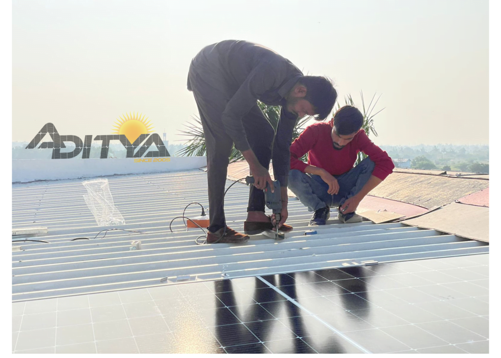Workers installing solar panels on shed