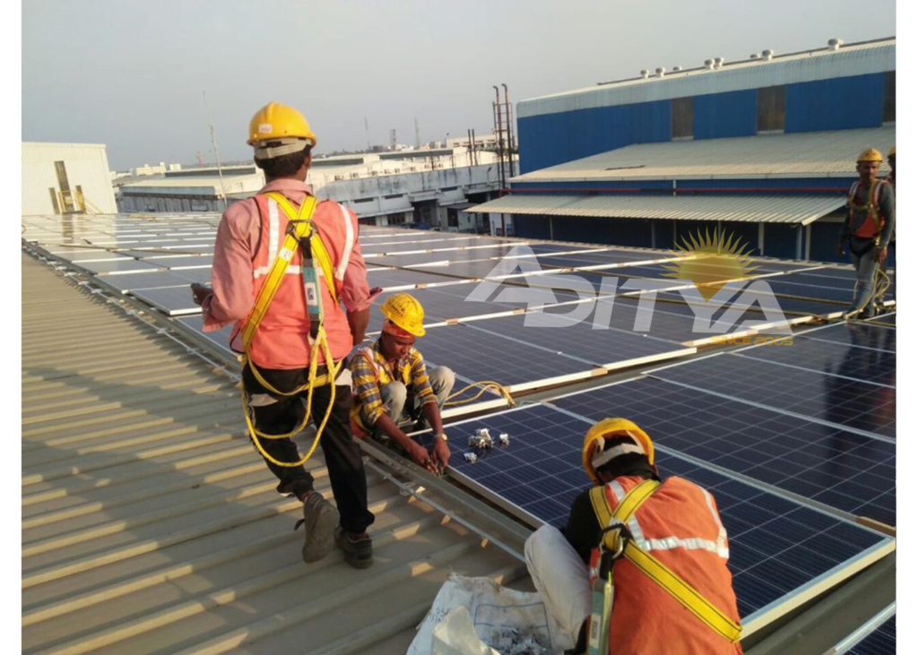 Workers Installing solar panels on the rooftop