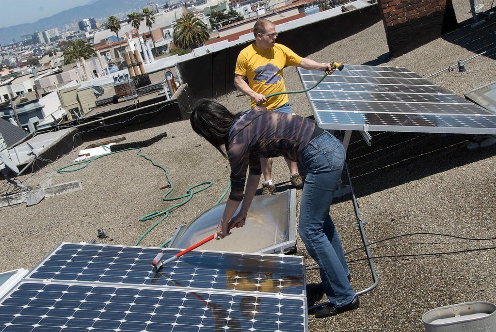 Women Cleaning Solar Panels